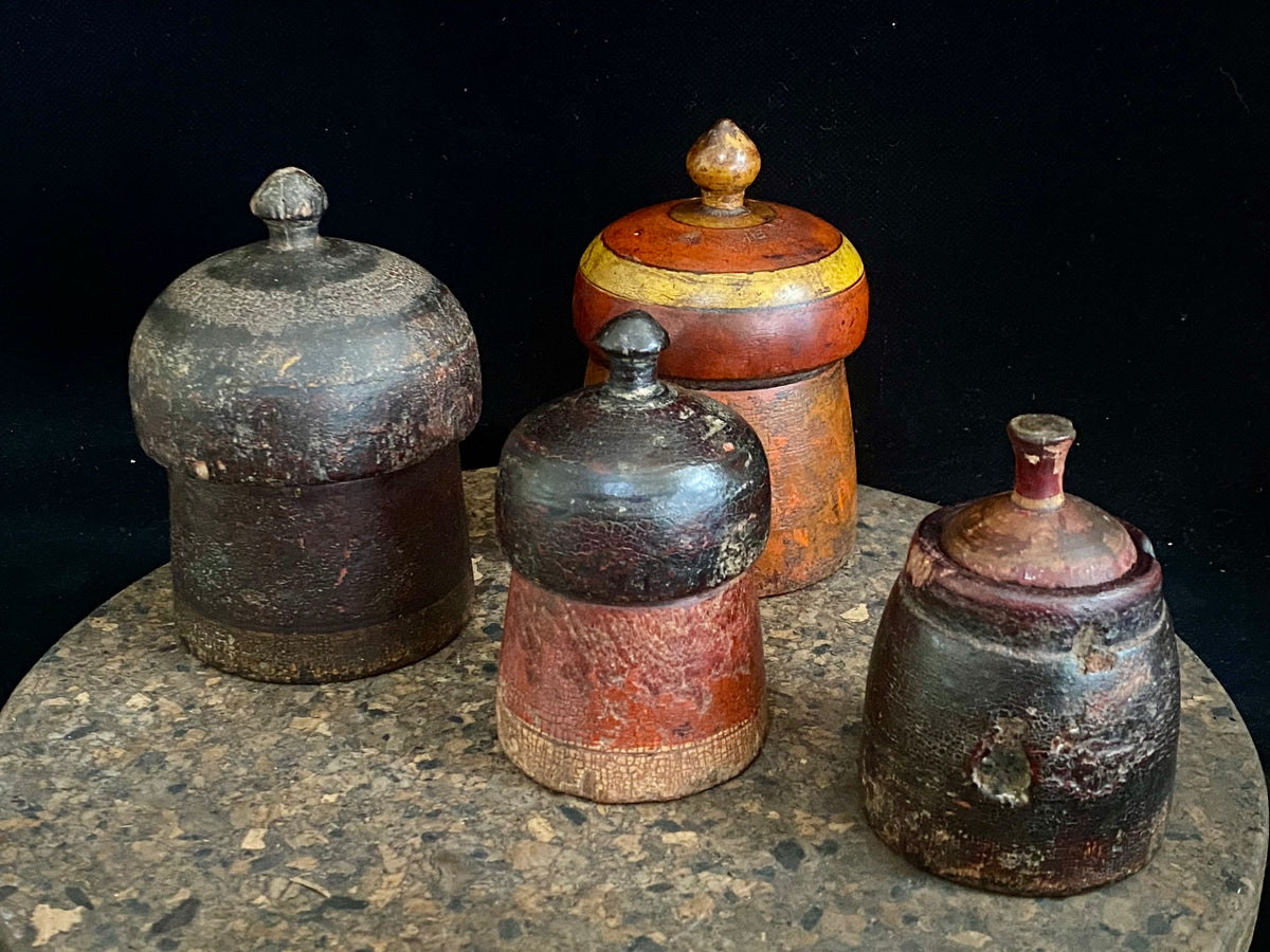 Antique small tikka pots. Hand carved teak, lacquer paint. Approx 50-90 years old. Assorted shapes, sizes and colours. Height approximately 9-12, diameter 6-8 cm