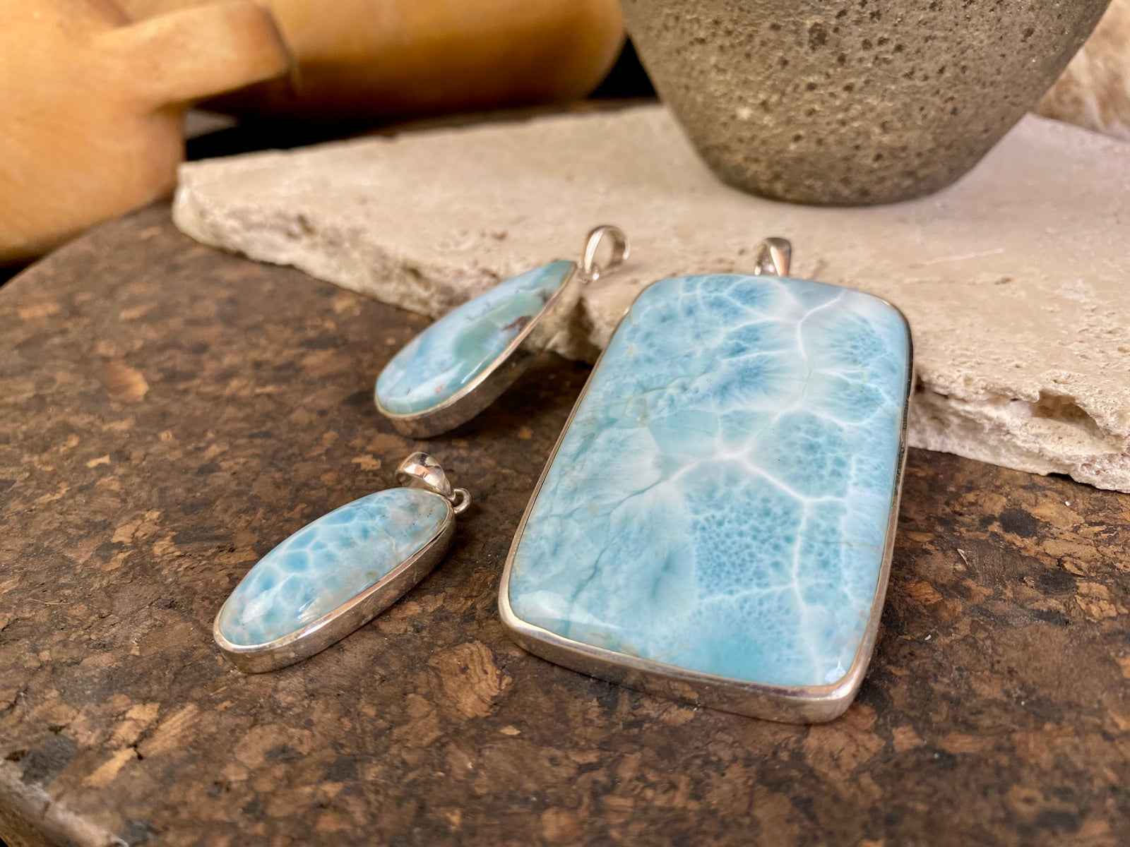 Larimar stone pendants set in sterling silver. Each pendant is unique, cut and mounted to showcase the beauty of the individual stones.