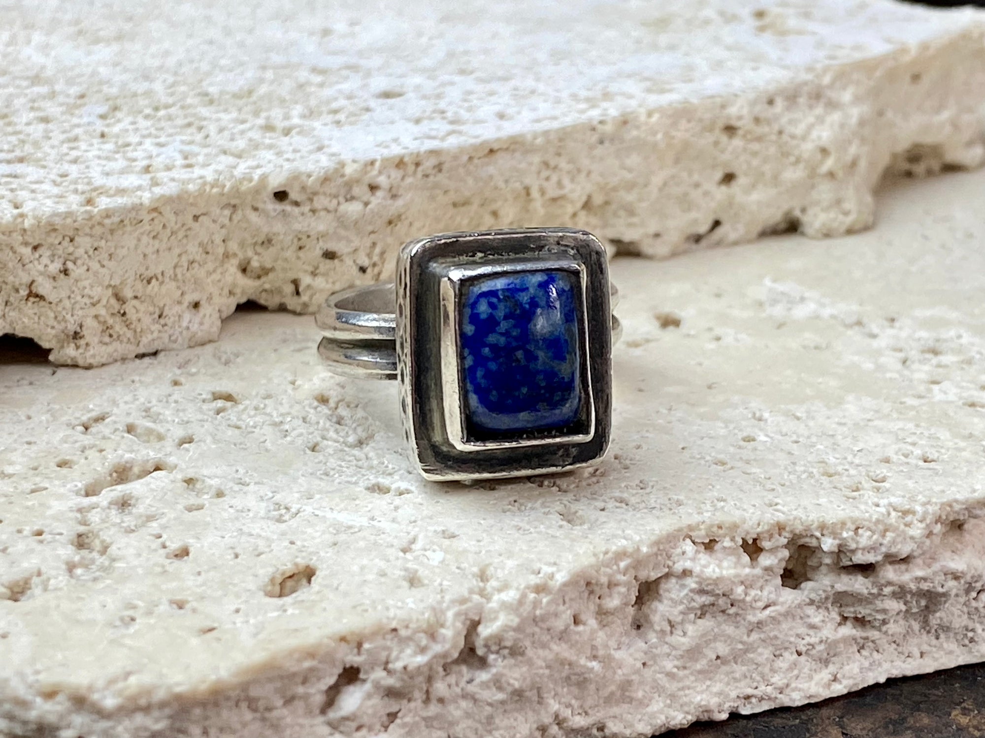 This beautiful vintage ring features a lapis lazuli stone. This ring sits high on the finger and is a definite statement piece. High grade silver. From Afghanistan, mid 20th century. Adjustable. Measurements: Ring face 1.6 x 1.3 cm, diameter 18.5 mm | Size 8.5 | No 19, to fit any finger from 7 - 9