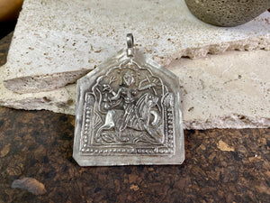 Very large Durga amulet - wear as a pendant or hang as an ornament. Early 20th century, the bail has been replaced at some stage as it most likely wore through..  Measurements: height 8.5 cm including bail, width 6.5 cm