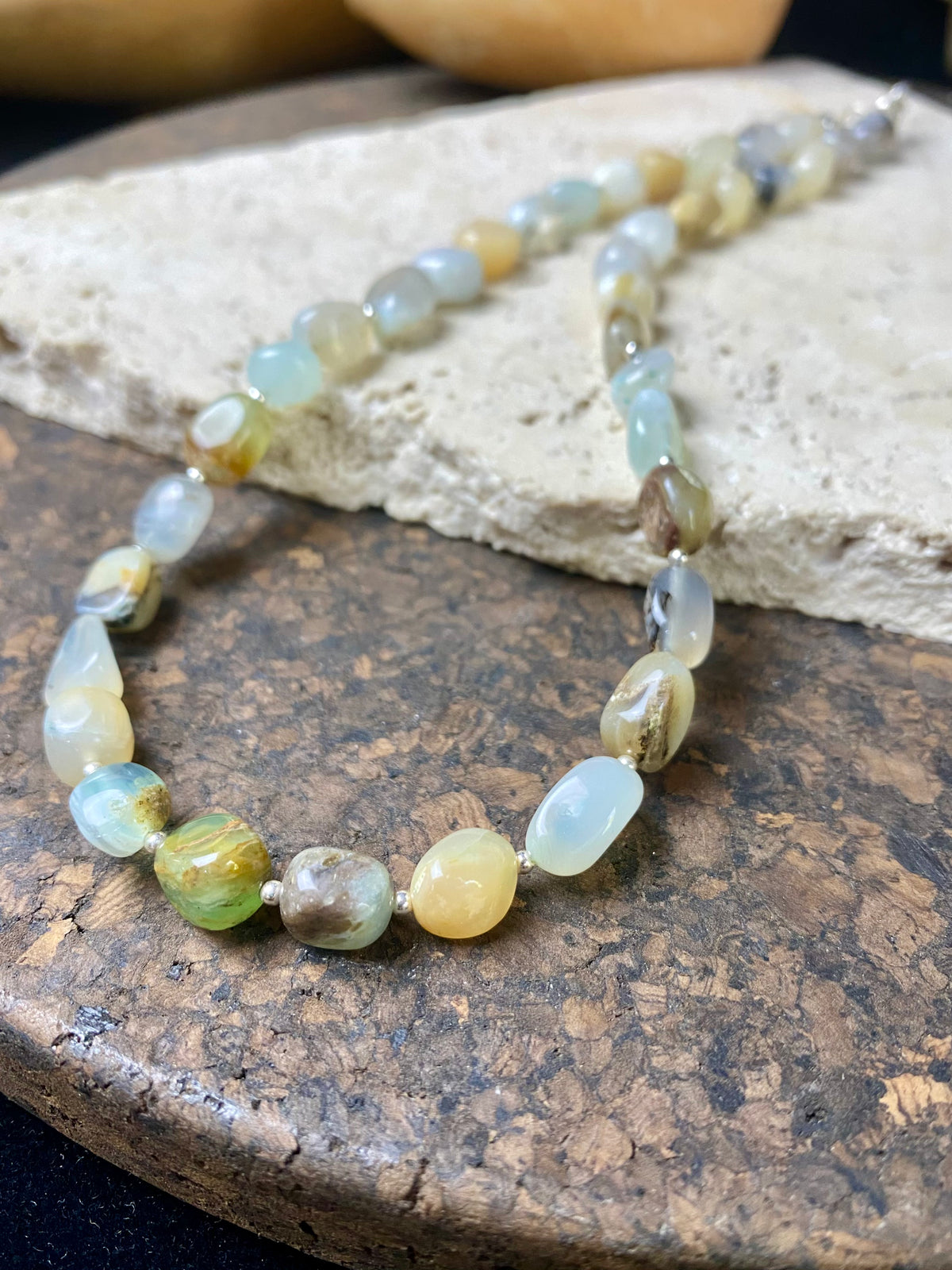 Striking boulder stone translucent blue opal necklace with sterling silver bead detailing, finished with a sterling silver hook clasp. Length 45.5 cm