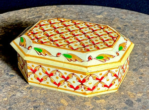 A compact trinket box, hand crafted from wood overlaid with polished hand shaped panels of camel bone, which are then exquisitely hand painted. Measurements 10 x 8 cm, height 4 cm