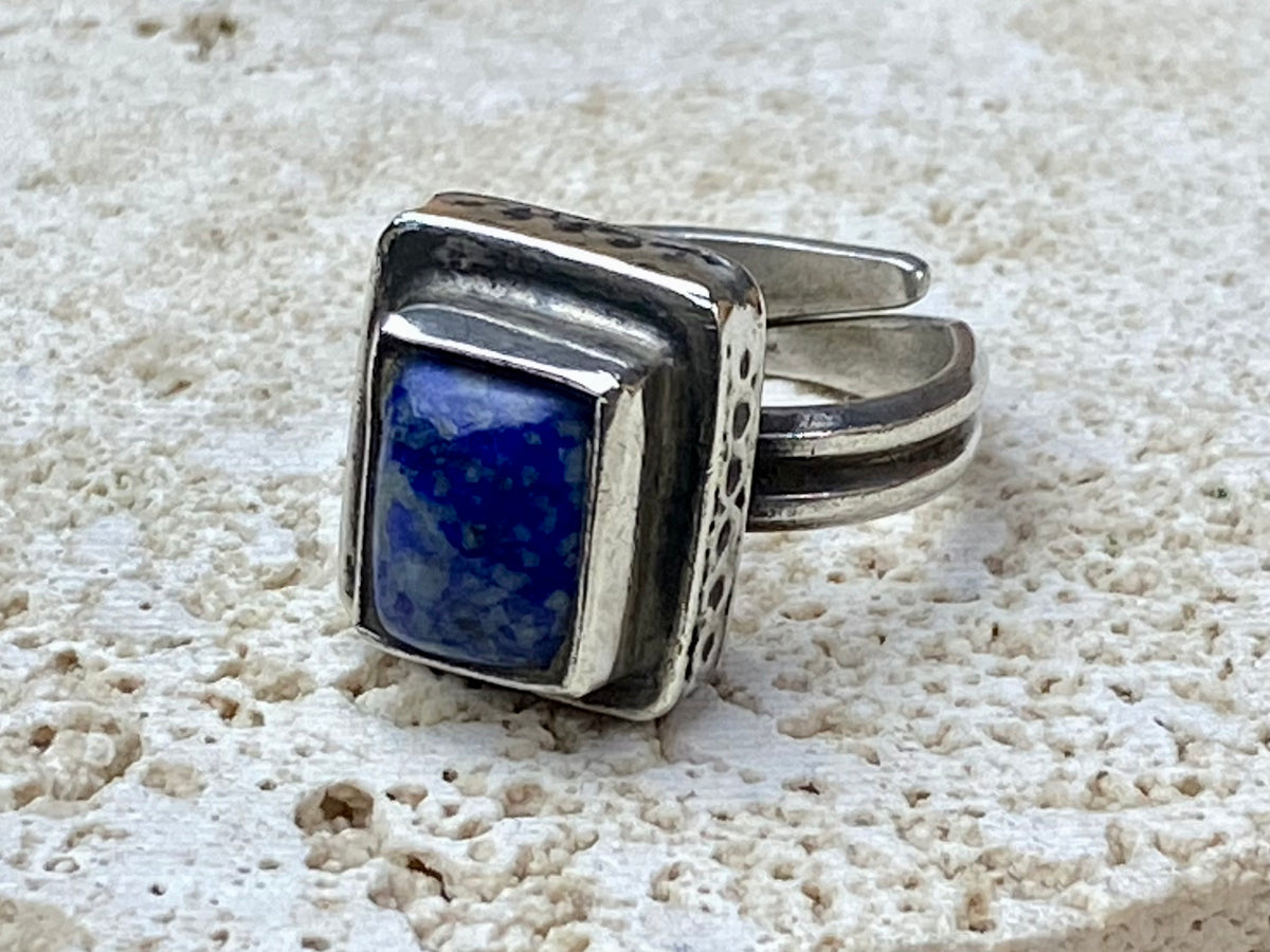This beautiful vintage ring features a lapis lazuli stone. This ring sits high on the finger and is a definite statement piece. High grade silver. From Afghanistan, mid 20th century. Adjustable. Measurements: Ring face 1.6 x 1.3 cm, diameter 18.5 mm | Size 8.5 | No 19, to fit any finger from 7 - 9
