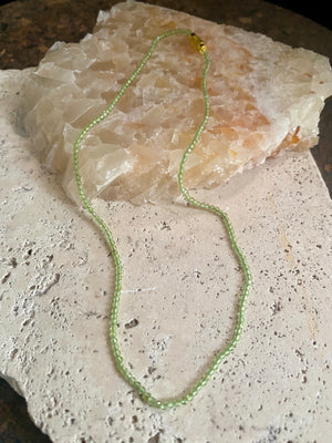 Natural clear green peridot bead necklace. Brass screw clasp. Length 37 cm