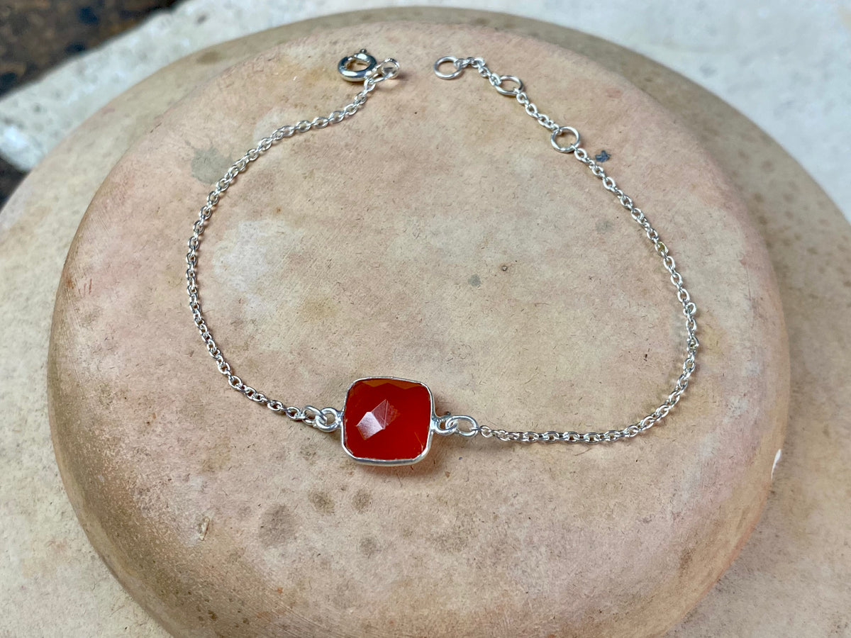 Elegant bracelets set with single stones in a sterling silver chain and clasp. Note that these bracelets are adjustable in length to suit your wrist size  Measurements: 17.2 - 19.8 cm length