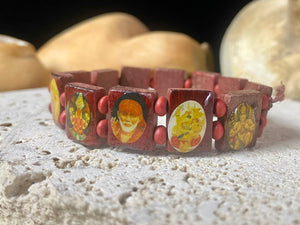 Simple, lightweight and fun, this elasticised bracelet is made up of small panels that feature images of various Hindu gods, including Lakshmi, Ganesh, Krishna and more. This is a great one for the kids, or if you'd simply like some universal protection.  Measurements: Panels 1.2 x 1.5 cm, inside bracelet circumference 15 cm.