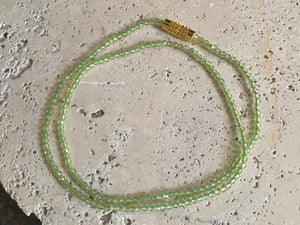 Natural clear green peridot bead necklace. Brass screw clasp. Length 37 cm