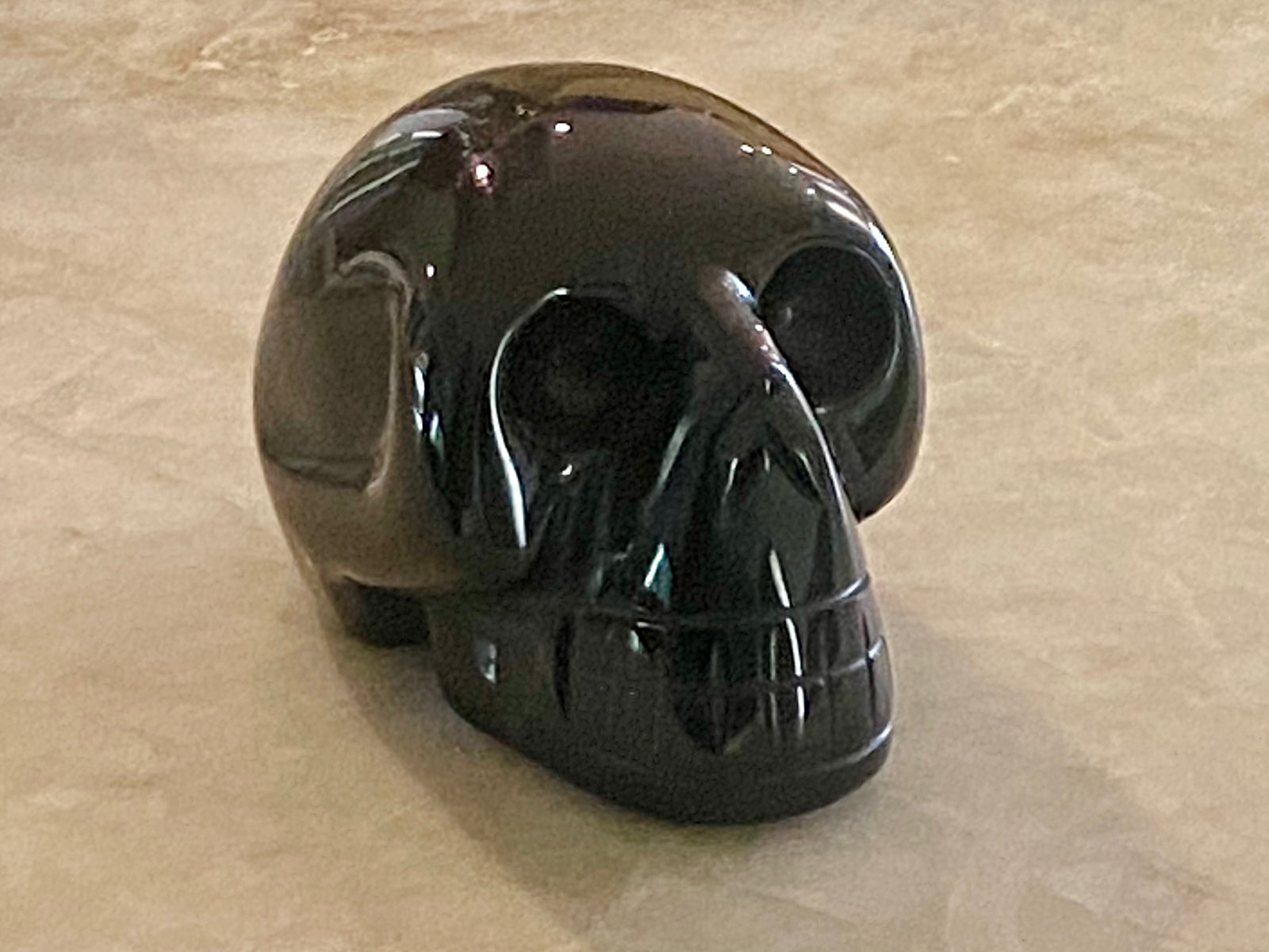 Black onyx hand carved skull. 3 x 5 x 3 cm