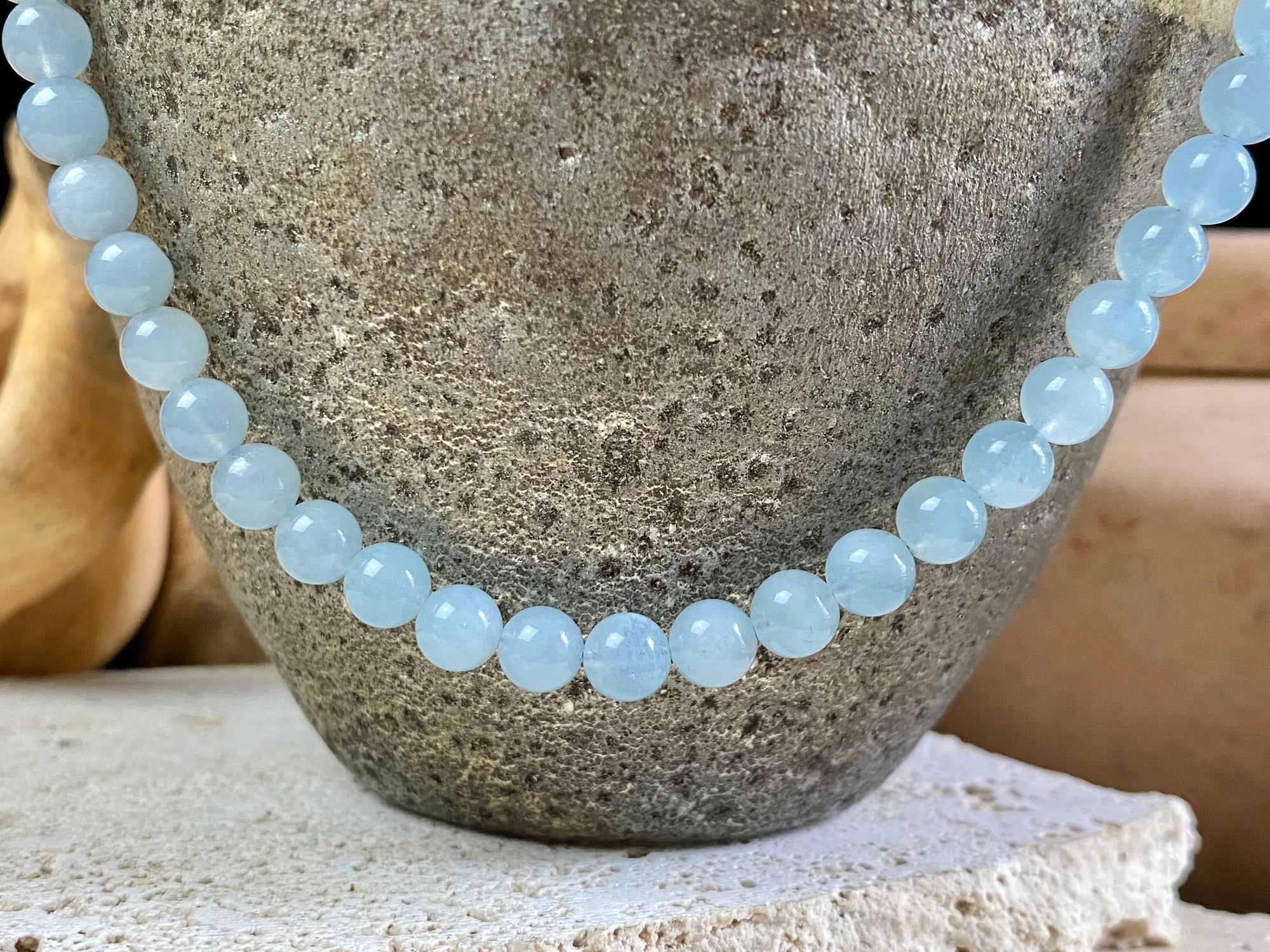 Natural aquamarine necklace featuring round aquamarine beads and a sterling silver clasp.   The aquamarines are matched a light and even blue of beautiful quality. Measurements: 47.5 cm