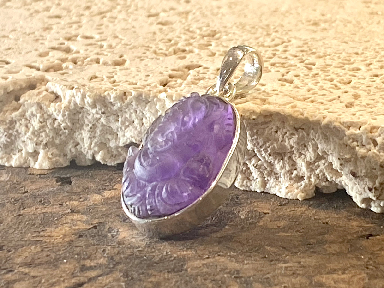 Hand carved amethyst ganesh pendant in a sterling silver mount. Height 3.3 cm