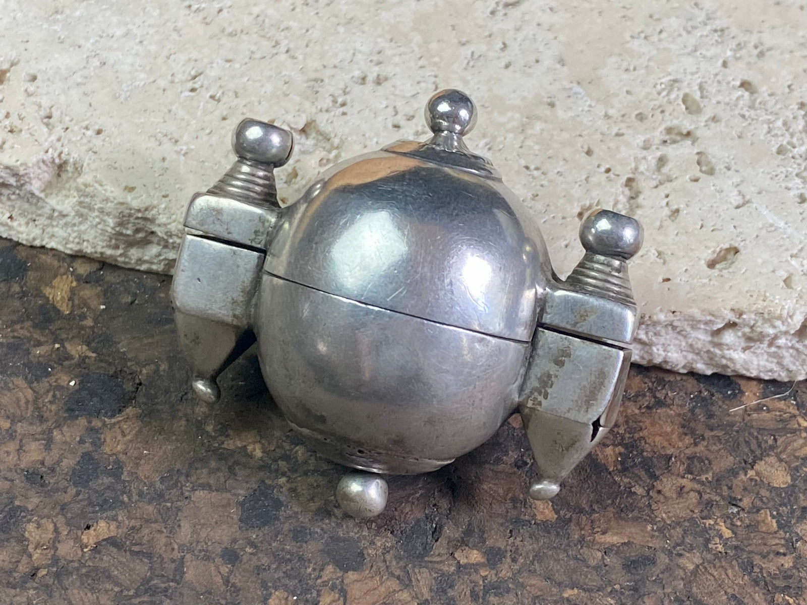 This Shiva lingam box or container is is a fine example of casket workmanship. Dating from the early 20th century or earlier, it is hand cast from high-grade silver & features wear marks commensurate with a piece this age. Measurements: Height 4.8 cm (1.85"), width 5 cm (2")