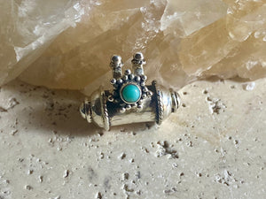 These lovely box pendants open at one end and have plenty of room to place items inside. Two bails complete the look. Sterling silver, finished with a turquoise stone.  Two sizes to choose from