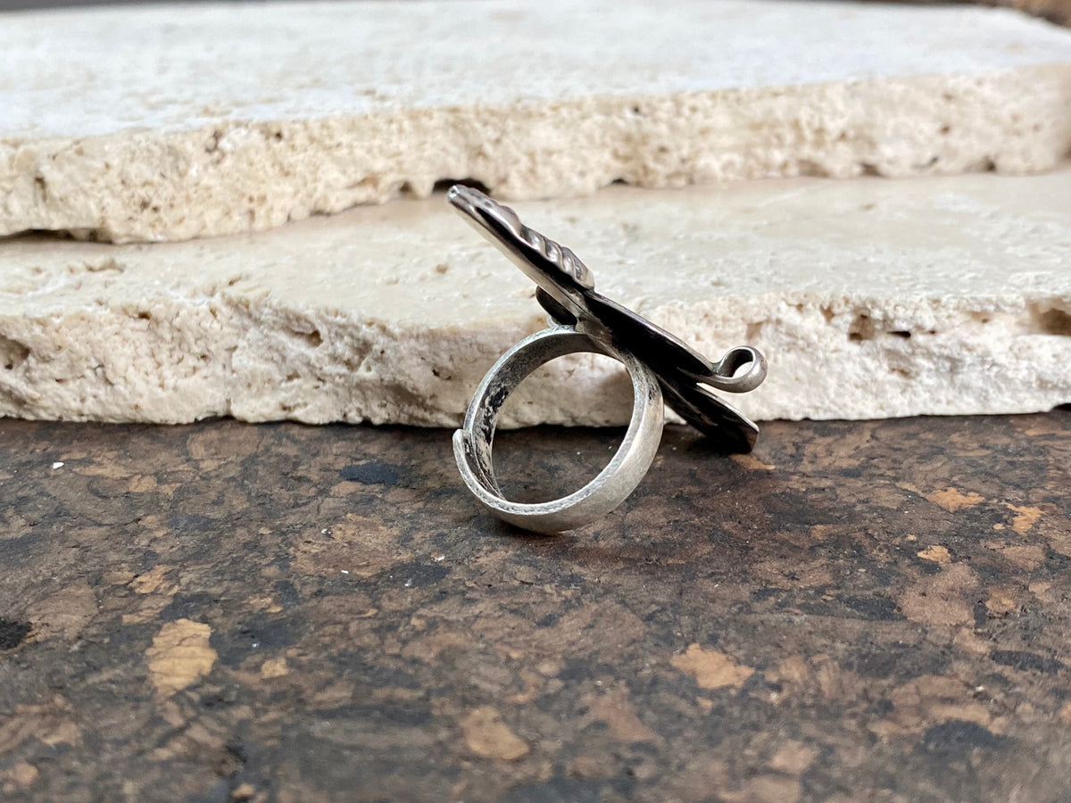 Stunning tribal ring from regional Rajasthan, India. High grade or sterling silver. Adjustable back so it will fit a number of different finger sizes.  Measurements:  Ring face: 4.5 x 2.6 cm Size: Anywhere from size 6 to size 8, this ring is adjustable