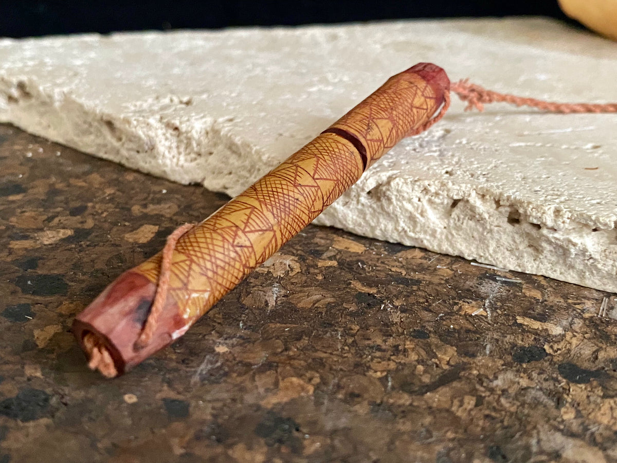 This is a vintage wood sewing needle case from northern Thailand, from the Ahka tribe. This beautiful, old and rare vintage piece is highly decorated and made from bamboo, etched, stained with red betel juice and. Length 8.5 cm.