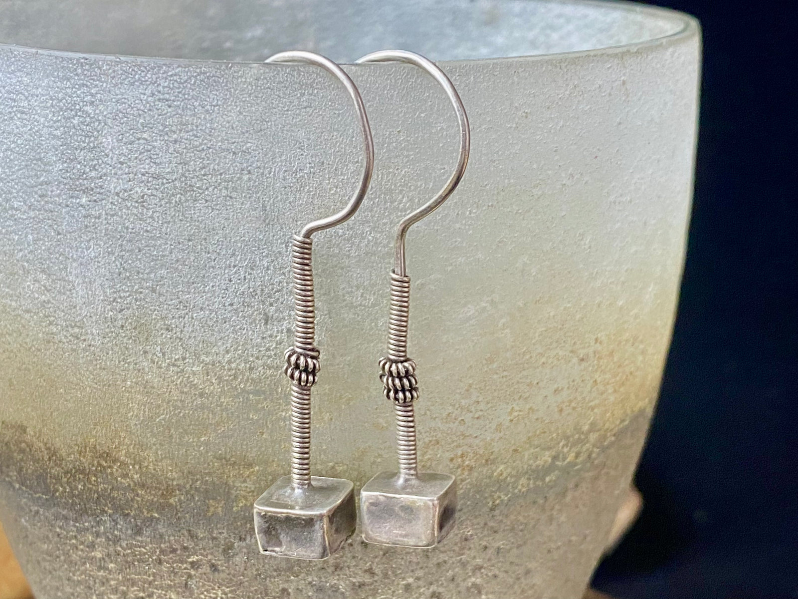Rabari tribal earrings. High grade silver. Hollow construction, lightweight and easy to wear. Mid 20th century. Traditionally worn in both the ear lobe and in the upper cartilage of the ear. Length 5.8 cm