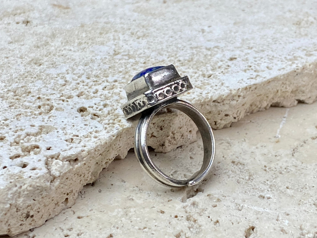 This beautiful vintage ring features a lapis lazuli stone. This ring sits high on the finger and is a definite statement piece. High grade silver. From Afghanistan, mid 20th century. Adjustable. Measurements: Ring face 1.6 x 1.3 cm, diameter 18.5 mm | Size 8.5 | No 19, to fit any finger from 7 - 9