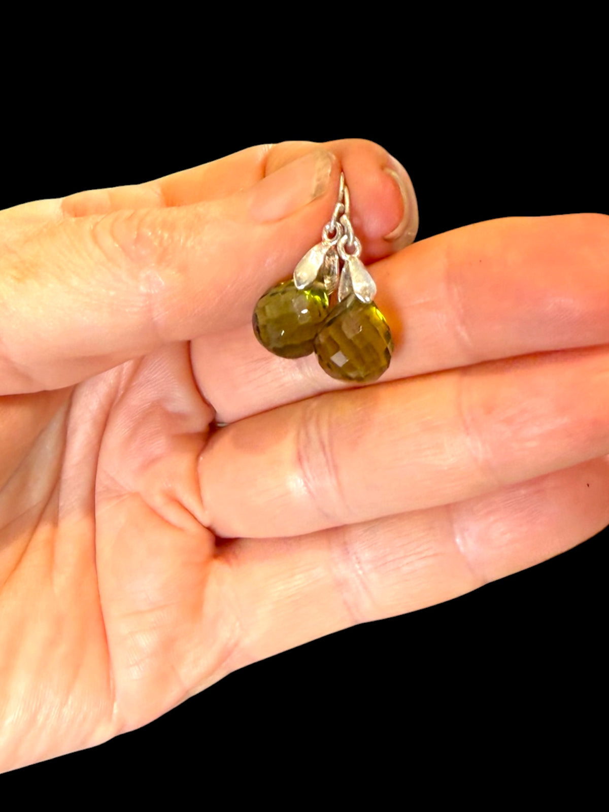 Elegant teardrop green amethyst earrings featuring facet cut gem quality stones with sterling silver mounts and hooks. Height 2.7 cm including hook
