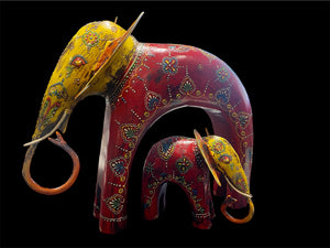 Hand made from hard wood and recycled iron, our beautiful elephant statues are painted in bright embossed detail. Large: height 27 cm, length 32 cm, depth 12 cm. Small: height 12 cm, length 15 cm, depth 6 cm