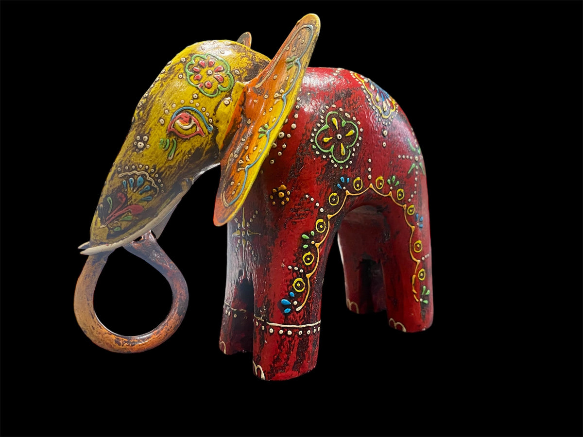 Hand made from hard wood and recycled iron, our beautiful elephant statues are painted in bright embossed detail. Large: height 27 cm, length 32 cm, depth 12 cm. Small: height 12 cm, length 15 cm, depth 6 cm