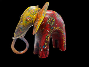 Hand made from hard wood and recycled iron, our beautiful elephant statues are painted in bright embossed detail. Large: height 27 cm, length 32 cm, depth 12 cm. Small: height 12 cm, length 15 cm, depth 6 cm