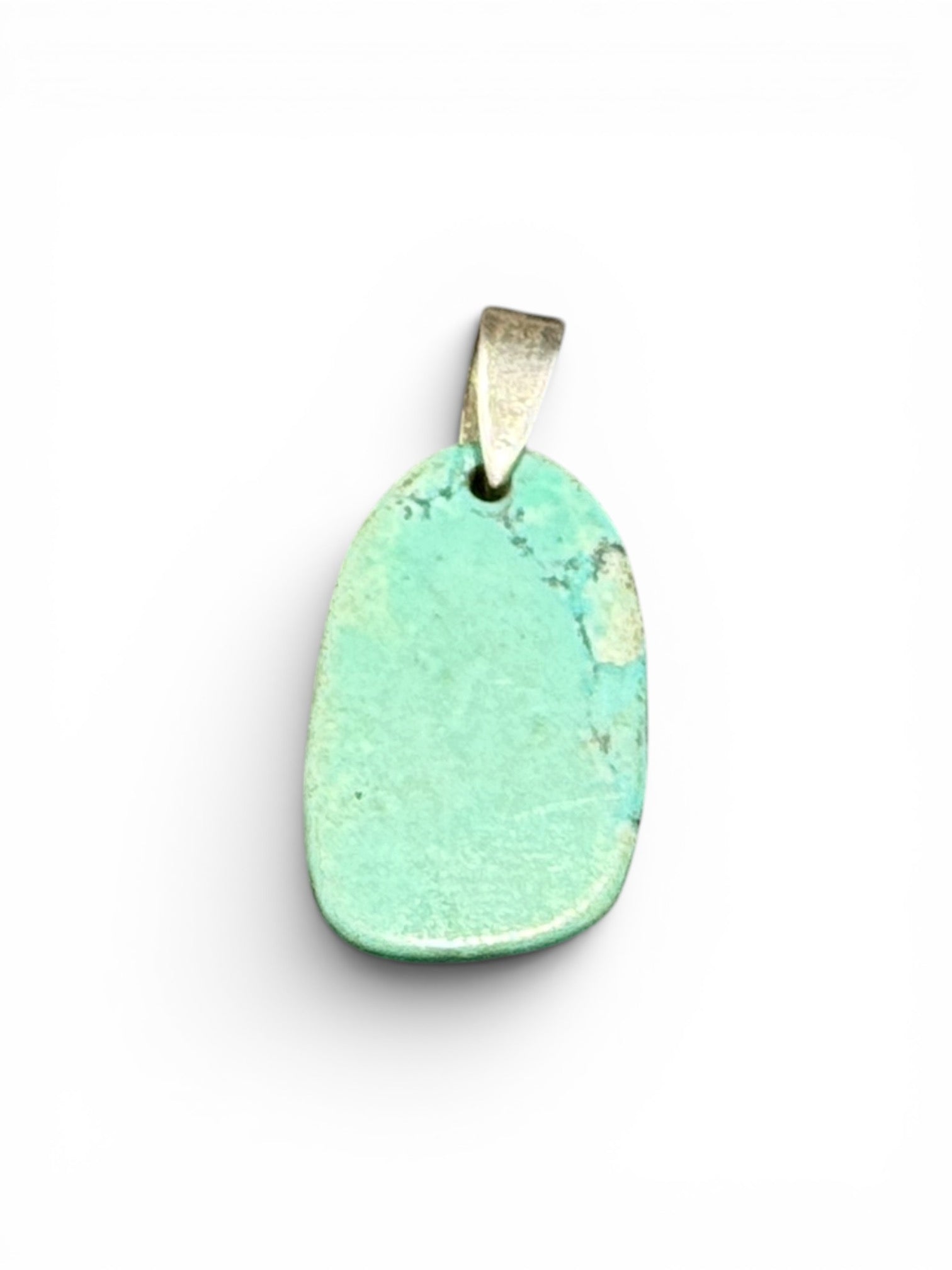 Simple but striking pendant made from a hand shape plate of turquoise-dyed howlite stone, with a sterling silver bail. Height including hook 2.8 cm