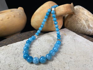 Graduated blue chalcedony necklace with sterling silver bead detailing and a sterling silver hook clasp. Measurements: 41.5 length including hook, diameter of beads 8, 6 and 4 mm