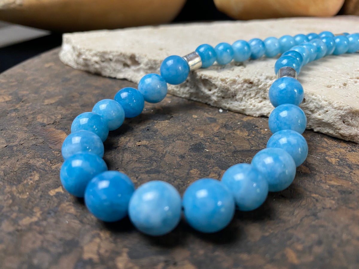 Graduated blue chalcedony necklace with sterling silver bead detailing and a sterling silver hook clasp. Measurements: 41.5 length including hook, diameter of beads 8, 6 and 4 mm