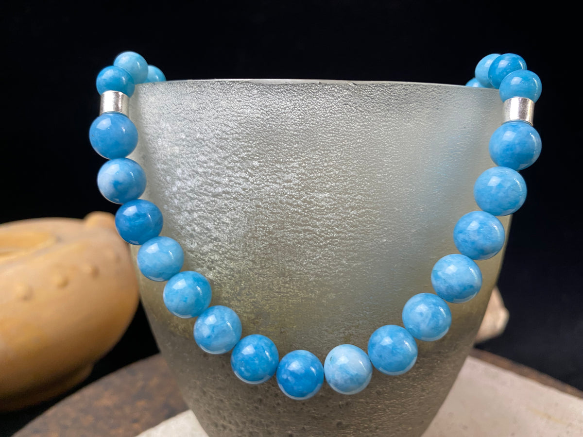 Graduated blue chalcedony necklace with sterling silver bead detailing and a sterling silver hook clasp. Measurements: 41.5 length including hook, diameter of beads 8, 6 and 4 mm