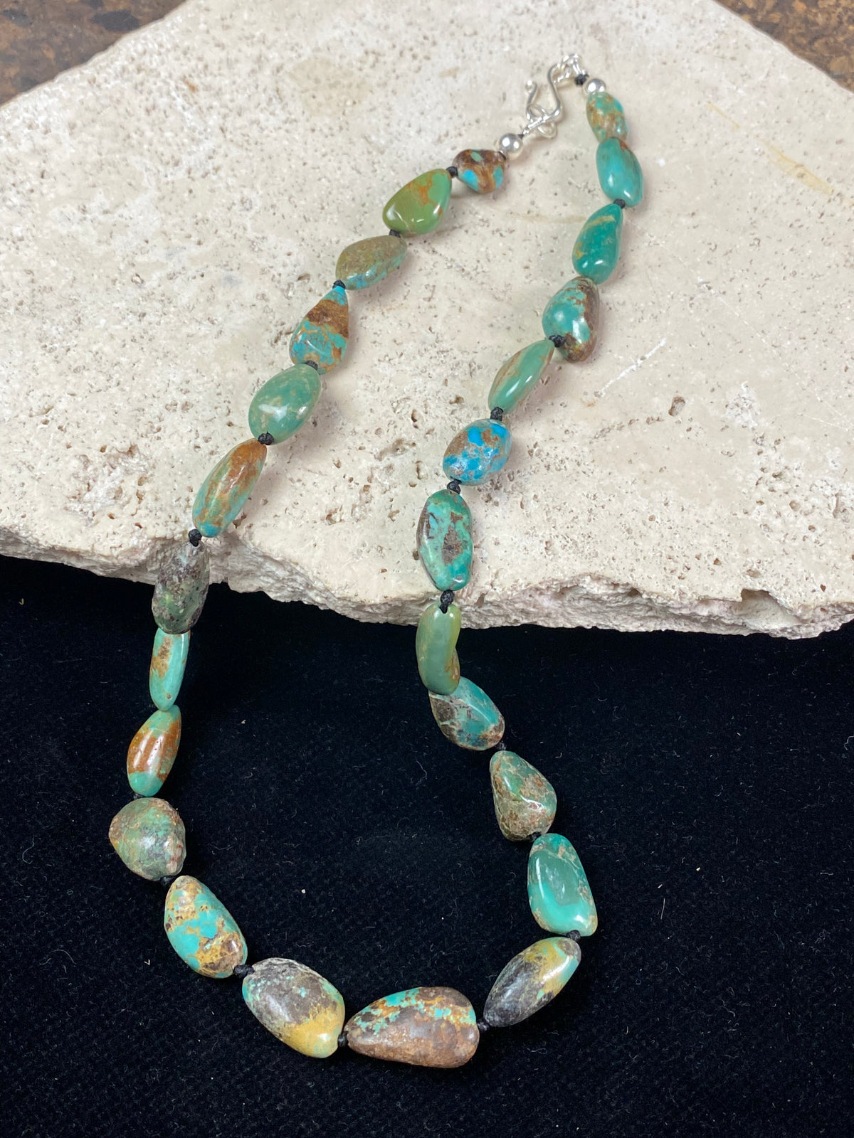 Tibetan turquoise necklace. Knotted between each bead and finished with sterling silver clasp. length 46.5 cm