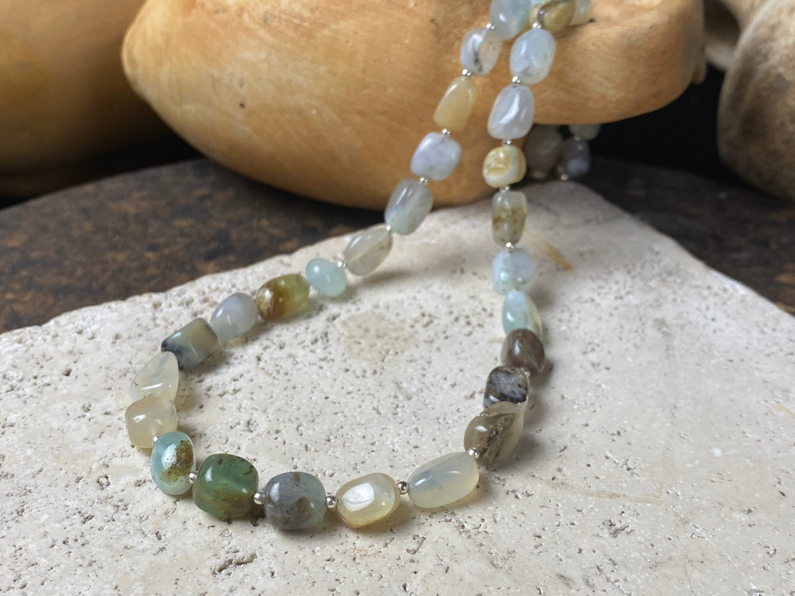 Striking boulder stone translucent blue opal necklace with sterling silver bead detailing, finished with a sterling silver hook clasp. Length 45.5 cm