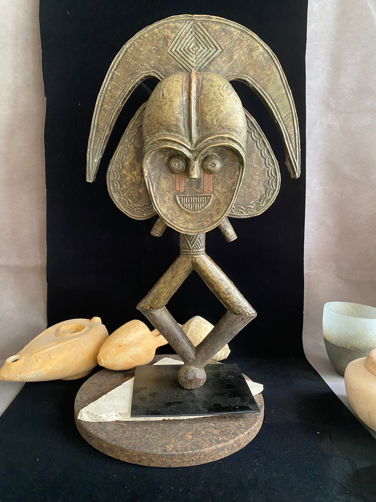 Mbulu-ngulu or funerary reliquary protective figure. Kota people, Gabon, West Africa. Mid to late 20th century. Wood with copper and brass decorative overlay. Height 54 cm, width at widest point 30 cm.