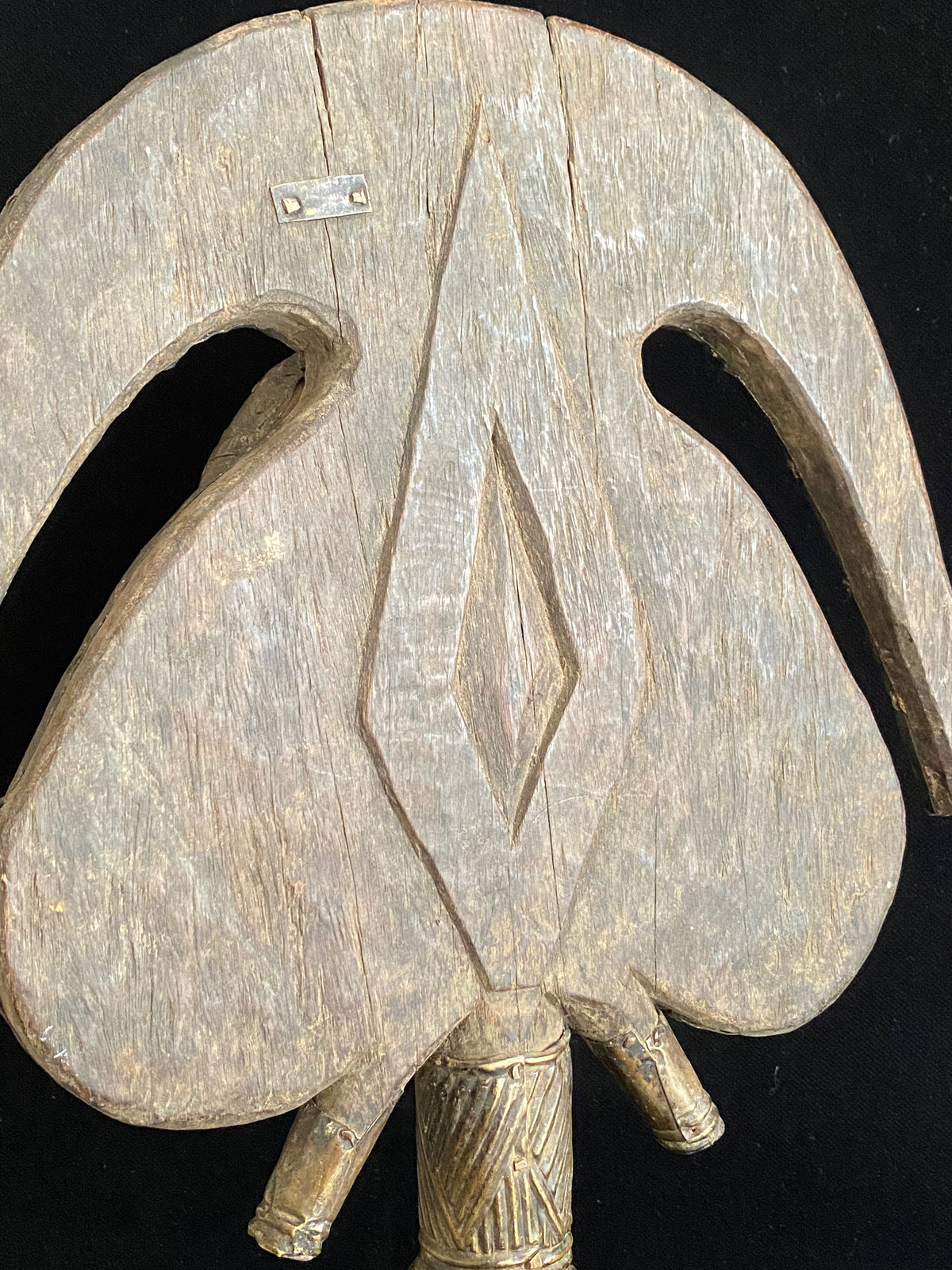 Mbulu-ngulu or funerary reliquary protective figure. Kota people, Gabon, West Africa. Mid to late 20th century. Wood with copper and brass decorative overlay. Height 54 cm, width at widest point 30 cm.