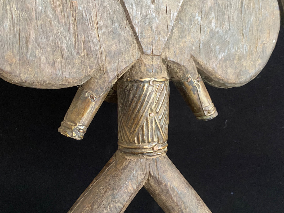 Mbulu-ngulu or funerary reliquary protective figure. Kota people, Gabon, West Africa. Mid to late 20th century. Wood with copper and brass decorative overlay. Height 54 cm, width at widest point 30 cm.