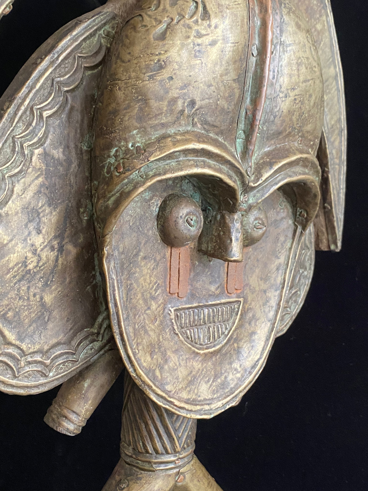 Mbulu-ngulu or funerary reliquary protective figure. Kota people, Gabon, West Africa. Mid to late 20th century. Wood with copper and brass decorative overlay. Height 54 cm, width at widest point 30 cm.