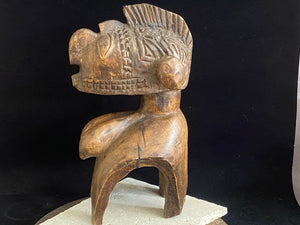 Nimba Mask house statue, Baga people, Guinea, West Africa. Mid 20th century. Carved from wood, this mask has the facial characteristics and long pendulous breasts typical of these figures. Height 31 cm, depth 15 cm, width at widest point 14 cm.