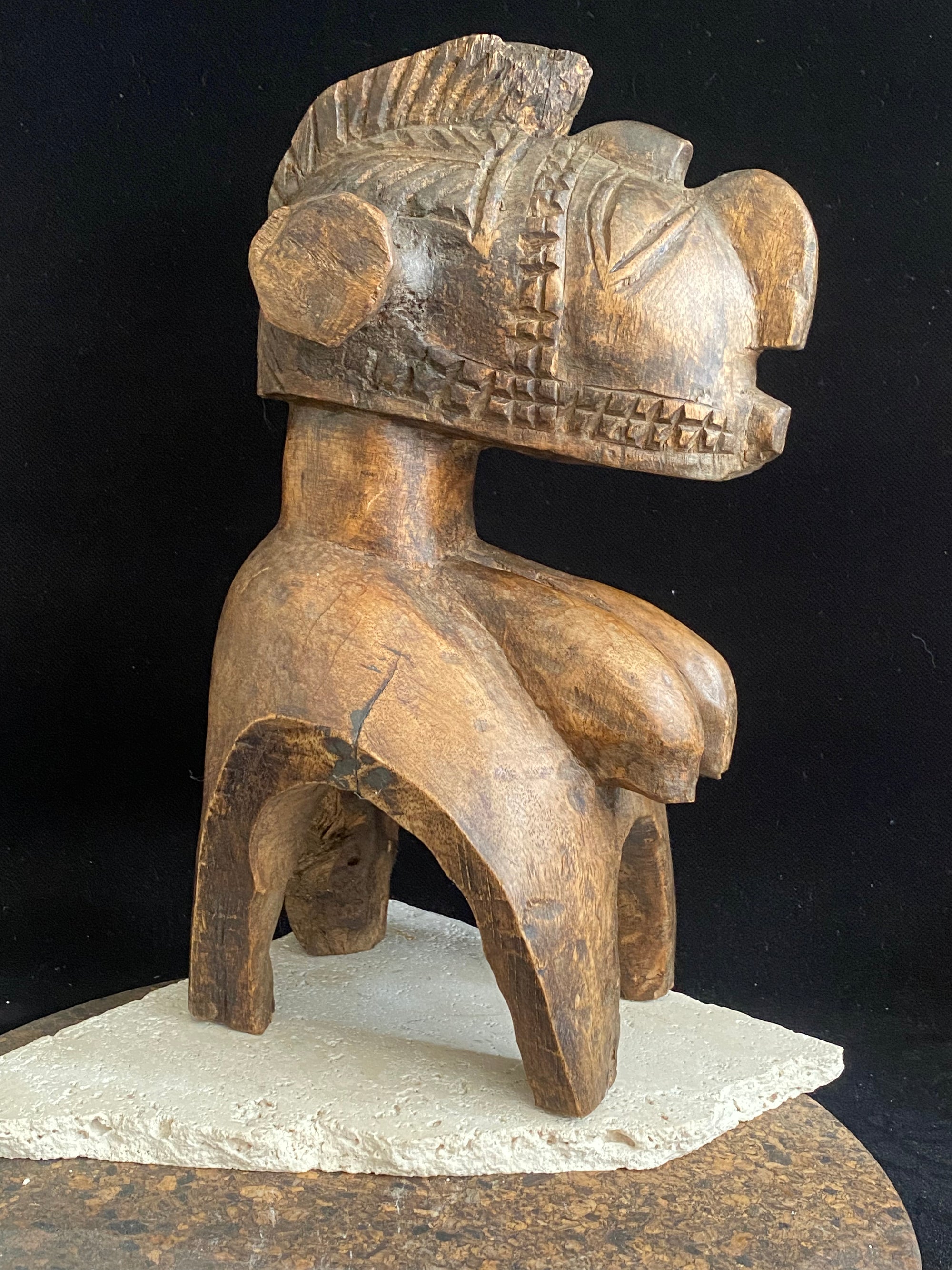 Nimba Mask house statue, Baga people, Guinea, West Africa. Mid 20th century. Carved from wood, this mask has the facial characteristics and long pendulous breasts typical of these figures. Height 31 cm, depth 15 cm, width at widest point 14 cm.