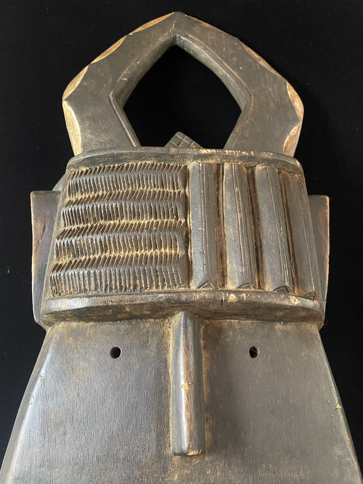 Landai mask. Toma people, Guinea, west Africa. Mid to late 20th Century. Used by the men's Poro society to initiate boys into manhood. Condition: very good. This mask dates to the mid to late 20th century. Measurements: height 83 cm, width 30 cm, depth 12 cm.