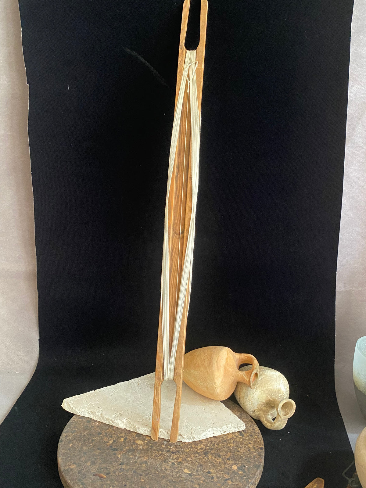 This unusual item is used to mend fishing nets. It is a very long, hand carved wood "needle" or shuttle with string or rope looped over it. If you're looking for unusual homewares or decorative items with a difference, or even a prop for a photo shoot, play or film set, this is it. Length 69 cm, width 4.5 cm