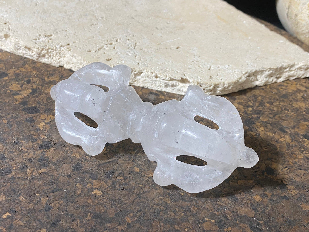 Hand carved dorje, also known as a vajra. Carved from a solid piece of Himalayan rock crystal (quartz).