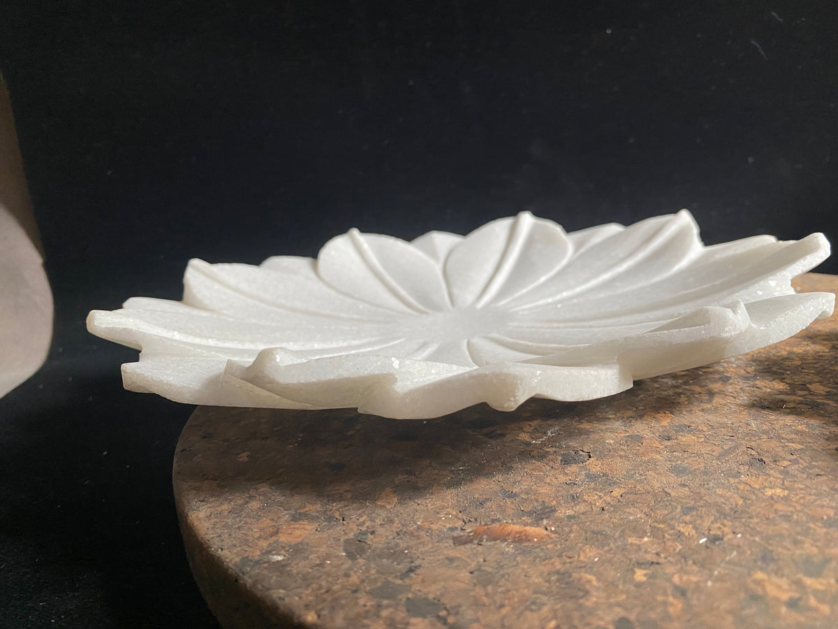 Hand crafted shallow bowls or plates, hand carved in Rajasthan from the finest local white marble in the form of an open lotus flower. Select from two sizes. Small 16 cm diameter, Large 26 cm diameter