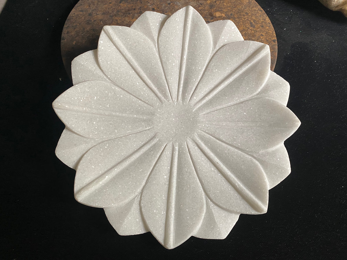 Hand crafted shallow bowls or plates, hand carved in Rajasthan from the finest local white marble in the form of an open lotus flower. Select from two sizes. Small 16 cm diameter, Large 26 cm diameter