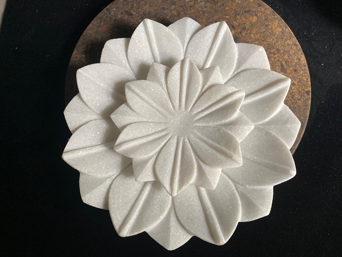 Hand crafted shallow bowls or plates, hand carved in Rajasthan from the finest local white marble in the form of an open lotus flower. Select from two sizes. Small 16 cm diameter, Large 26 cm diameter