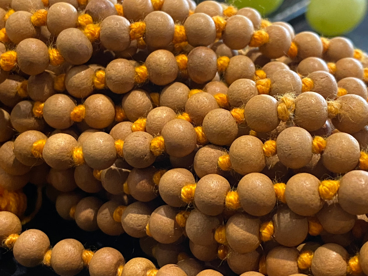 Women or men’s fine sandalwood mala necklace. Made from natural sandalwood. Knotted between each bead. As per a standard Buddhist mala, it contains 108 beads. Each bead 5 mm diameter