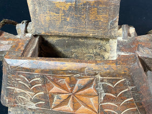 These oddly shaped pots were used to store mustard oil, ghee, yak butter and lantern oil. This very heavy example weighs 2.4 kg and is carved from solid teak. Hand beaten iron hinges. Traces of oil encrustation still inside. Age 1900-1920 or earlier. Measurements: width 29 cm, depth 12 cm, height 13.5 cm