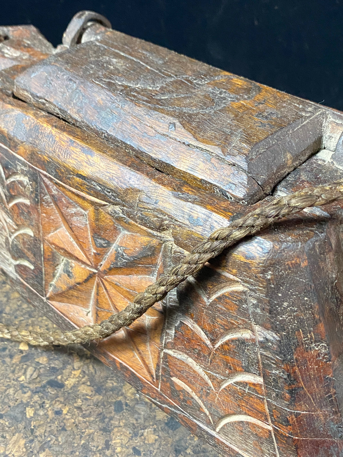 These oddly shaped pots were used to store mustard oil, ghee, yak butter and lantern oil. This very heavy example weighs 2.4 kg and is carved from solid teak. Hand beaten iron hinges. Traces of oil encrustation still inside. Age 1900-1920 or earlier. Measurements: width 29 cm, depth 12 cm, height 13.5 cm