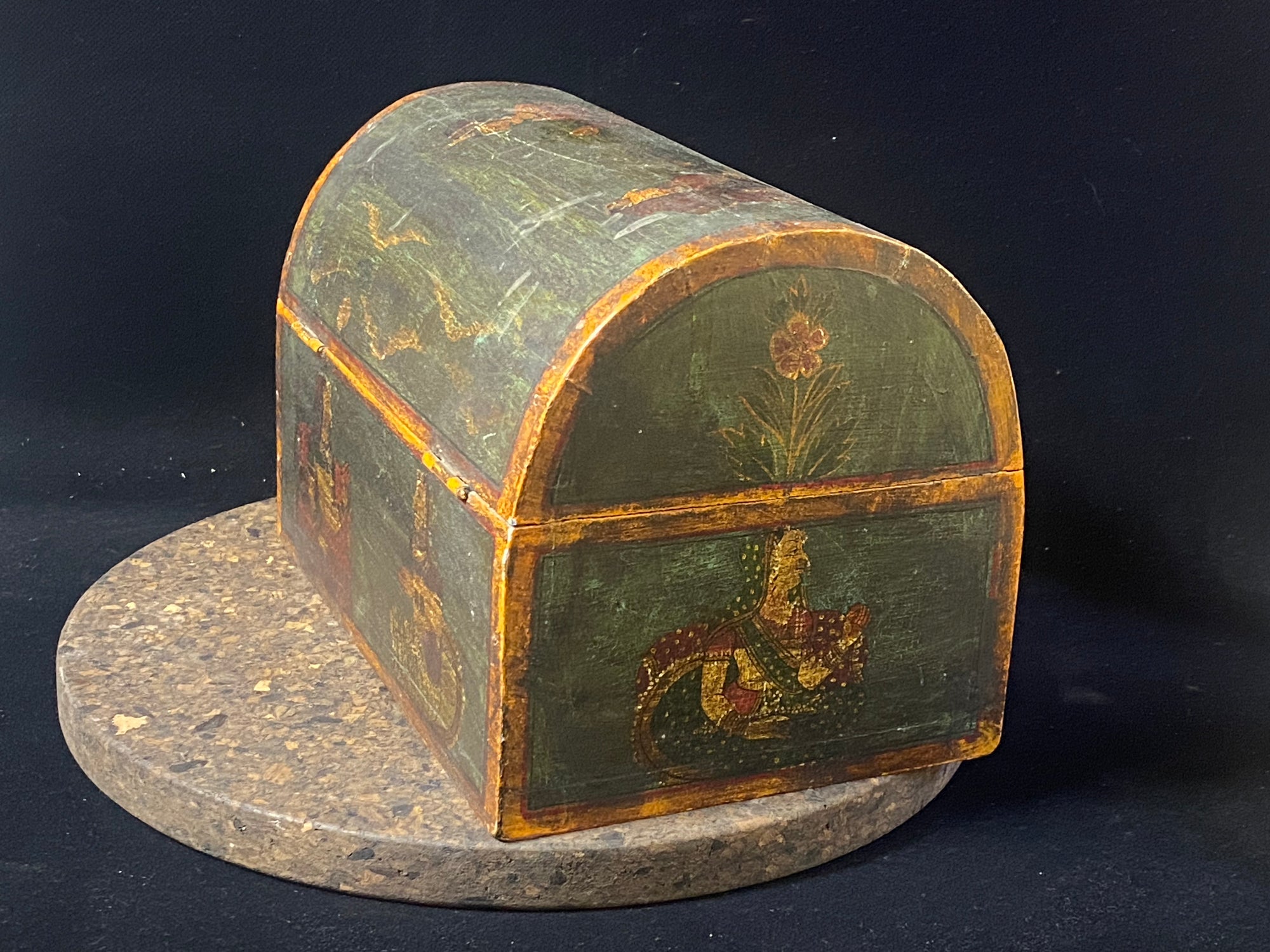 A lovely old painted Indian chest with domed top in the shape of a treasure chest. Painted on all sides with images of Indian lords and ladies. Made from teak. This would make a lovely trinket box, key box, jewellery, watch or cufflink box. Circa 1940. Measurements: length 24 cm x depth 15.5 cm, height 16 cm