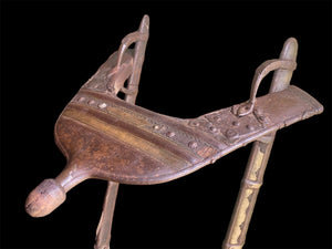 Antique camel saddle, Rajasthan, India. Early 20th century. Brass and Iron over hardwood.
