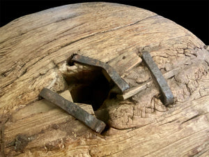 Antique solid teak wood cart wheel, rural India, early 20th century. Natural age and texture, central iron spoke hole and staples. Diameter 73 cm, depth 20 cm