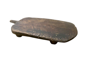 Antique low wood table, originally for bread cutting from Türkiye. Carved from a single piece of wood. Length 74 cm including handle, width 44 cm, height 14 cm.