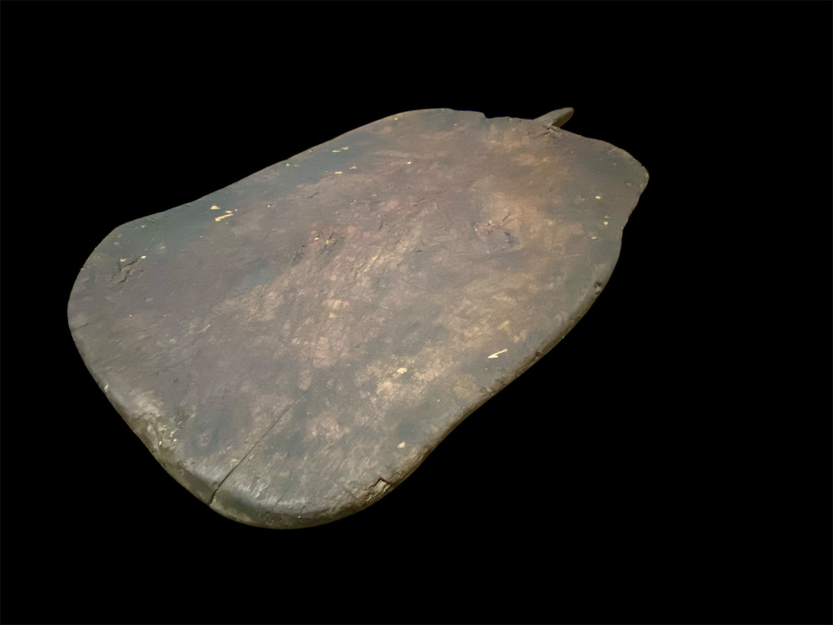 Antique low wood table, originally for bread cutting from Türkiye. Carved from a single piece of wood. Length 74 cm including handle, width 44 cm, height 14 cm.